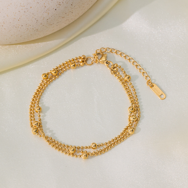 Brazalete Triple de Bolitas Doradas