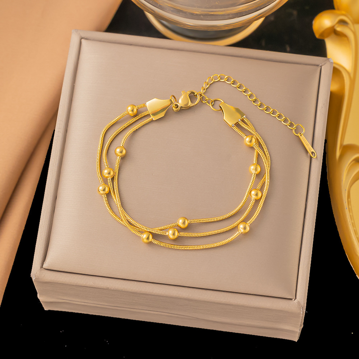 Brazalete Triple Cola de Raton Con Esferas Dorado